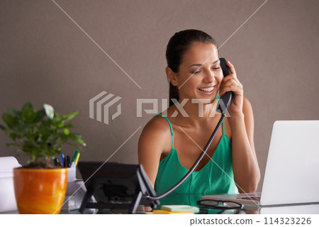 Phone call, remote work and landline with woman secretary in office for communication or reception. Laptop, smile and happy young receptionist answering telephone for small business or startup Phone call, remote work and landline with woman secretary in office for communication or reception. Laptop, smile and happy young receptionist answering telephone for small business or startup 114323226