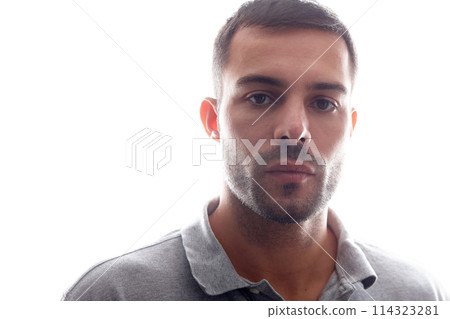 Portrait, confident and man, beauty and studio with serious facial expression for natural beard. Confused, masculine and male model with care fashion for stylish clothing on isolated white background 114323281