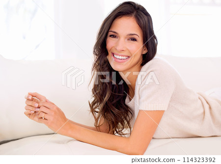 Portrait, happy or woman on couch to relax in living room on holiday in hotel, house or apartment. Lying down, sofa or female person with smile, wellness or confidence on break to rest in alone time Portrait, happy or woman on couch to relax in living room on holiday in hotel, house or apartment. Lying down, sofa or female person with smile, wellness or confidence on break to rest in alone time 114323392