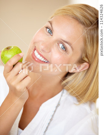 Happy woman, holding and apple in portrait for health, nutrition or wellness. Female person, smile and fruit in hand for wellbeing, vitamin or fibre with choice for natural, fresh or organic diet 114324626