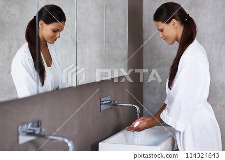 Woman, soap and washing hands in bathroom for hygiene, skincare and germ protection or wellness at home or hotel. Young person with water from tap, product and cleaning of bacteria or health at basin Woman, soap and washing hands in bathroom for hygiene, skincare and germ protection or wellness at home or hotel. Young person with water from tap, product and cleaning of bacteria or health at basin 114324643