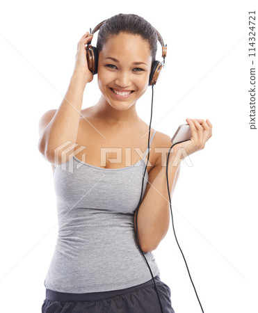 Happy woman, portrait and headphones listening to music for audio streaming against a white studio background. Female person smile enjoying sound track, podcast or playlist on smartphone with headset 114324721