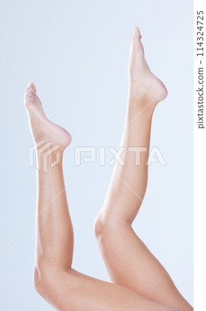 Body care, woman and legs in studio for depilation, hair removal and cosmetology for wellness and laser. Person, epilation and shaving routine for cosmetic, skincare and waxing on white background 114324725