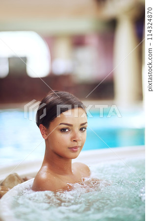 Woman, portrait and hot tub for calm at spa hotel or stress relief treatment or hydrotherapy, resort or hospitality. Female person, jacuzzi and accommodation in Miami or hygiene, resting or travel 114324870