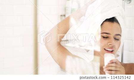 Woman, shower and relax in home, sing and product for skincare, cleaning and hygiene for girl in bathroom. House, silly and fun with karaoke with towel, aesthetic and grooming for body in morning 114325142