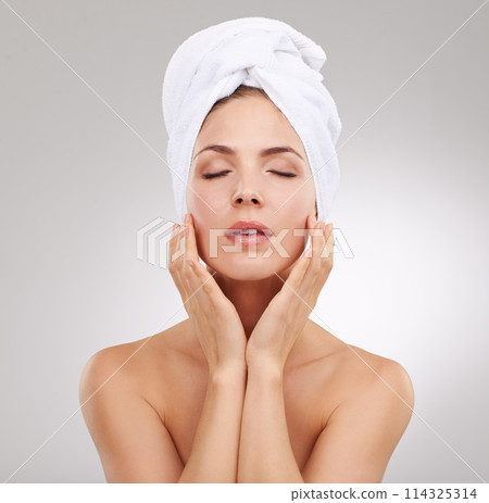 Beauty, cosmetics and face of woman with towel, natural glow and getting ready in studio. Dermatology, healthy skin and girl on white background with luxury facial, morning routine and skincare. 114325314
