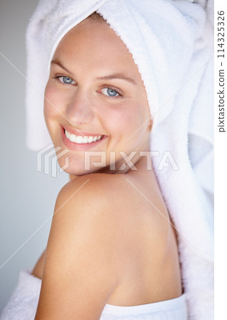 Portrait of happy woman, natural beauty or towel for wellness in house bathroom for glow. Morning, detox or confident female model with skincare results, self care or healthy skin for dermatology Portrait of happy woman, natural beauty or towel for wellness in house bathroom for glow. Morning, detox or confident female model with skincare results, self care or healthy skin for dermatology 114325326