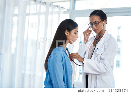 Im picking up some congestion. a young doctor examining her patient with a stethoscope. Im picking up some congestion. a young doctor examining her patient with a stethoscope. 114325374