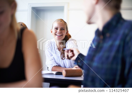 Student, note and pass a letter in class at high school with friends and social communication. Hand, paper and teenager writing secret, crush and information in classroom with quiet conversation Student, note and pass a letter in class at high school with friends and social communication. Hand, paper and teenager writing secret, crush and information in classroom with quiet conversation 114325407