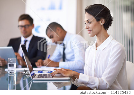 Woman, boardroom and smile with typing on laptop to brainstorm for presentation, paperwork and teamwork. Business people, office and personal assistant in table with strategy for company growth. Woman, boardroom and smile with typing on laptop to brainstorm for presentation, paperwork and teamwork. Business people, office and personal assistant in table with strategy for company growth. 114325423