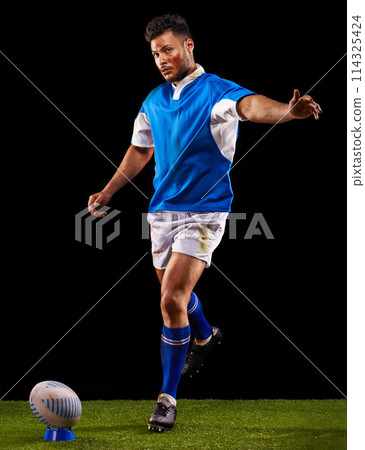 Kick, ball and portrait of man for rugby sport or training for workout, fitness and skill. Person or player on grass and athlete practice for goal or football game or match on black background. 114325424