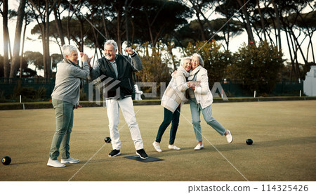 Bowls, high five and celebration with senior friends outdoor, cheering together during a game. Motivation, support or applause and a group of elderly people cheering while having fun with a hobby 114325426