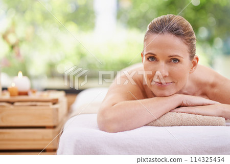 Happy woman, portrait and relax with spa, zen or massage at hotel or outdoor resort for stress relief. Face of female person with smile, enjoying facial or body treatment at accommodation in wellness Happy woman, portrait and relax with spa, zen or massage at hotel or outdoor resort for stress relief. Face of female person with smile, enjoying facial or body treatment at accommodation in wellness 114325454