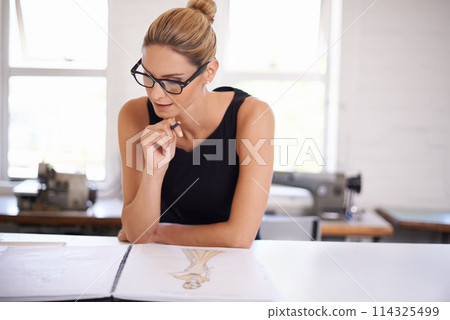 Fashion, planning and woman drawing as designer for clothes, ideas and brainstorming in workshop. Creative, tailor or person sketch in notebook with inspiration for unique style in boutique studio Fashion, planning and woman drawing as designer for clothes, ideas and brainstorming in workshop. Creative, tailor or person sketch in notebook with inspiration for unique style in boutique studio 114325499