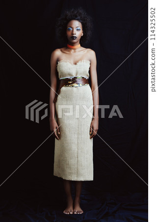Fashion, beauty and portrait of African woman on dark background with confidence, style and pride. Culture, aesthetic and isolated person with cosmetics, trendy accessories and makeup in studio Fashion, beauty and portrait of African woman on dark background with confidence, style and pride. Culture, aesthetic and isolated person with cosmetics, trendy accessories and makeup in studio 114325502