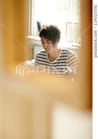 Man, relax and chilling in bedroom, peace and meditation for zen, wellness and calm at home. Male person, face and rest in apartment freedom and recharge for health, morning and breathe for wellbeing Man, relax and chilling in bedroom, peace and meditation for zen, wellness and calm at home. Male person, face and rest in apartment freedom and recharge for health, morning and breathe for wellbeing 114325592