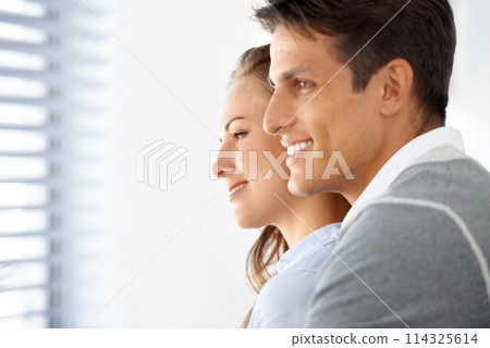 Couple, hug and happy or bonding by window, peaceful and romance in relationship or marriage. People, support and love in embrace, commitment and loyalty in partnership and trust or unity together 114325614