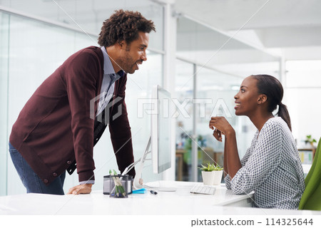 African man, woman and talking in office with smile for advice, chat and questions at startup company. Black people, employees and secretary with story, information and happy at creative media agency African man, woman and talking in office with smile for advice, chat and questions at startup company. Black people, employees and secretary with story, information and happy at creative media agency 114325644