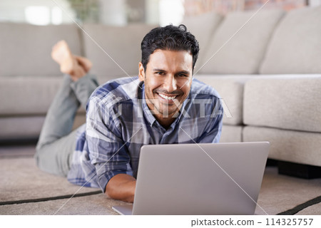 Man, freelancer and portrait for laptop on floor of living room, research and scroll or browse on web. Male person, happy and online for information or home for app, remote work and internet for plan Man, freelancer and portrait for laptop on floor of living room, research and scroll or browse on web. Male person, happy and online for information or home for app, remote work and internet for plan 114325757