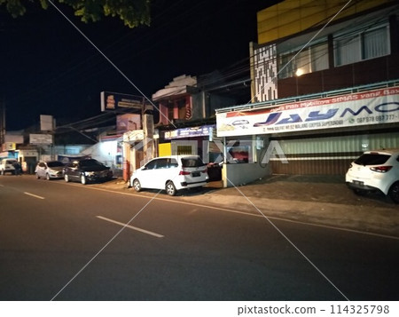 Car parks in urban areas are close to several industrial buildings 114325798