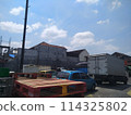Car parks in urban areas are close to several industrial buildings 114325802