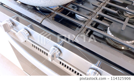 Crispy bacon strips bake evenly on a parchment-lined tray inside an oven, showcasing a clean and efficient method for achieving perfectly cooked bacon with minimal mess. Crispy bacon strips bake evenly on a parchment-lined tray inside an oven, showcasing a clean and efficient method for achieving perfectly cooked bacon with minimal mess. 114325906