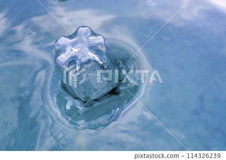 plastic bottle floats on the surface of the water plastic bottle floats on the surface of the water 114326239