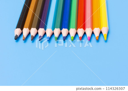 colored wooden pencils on a blue background 114326307