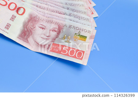 Swedish krona on a blue background with a large denomination 114326399