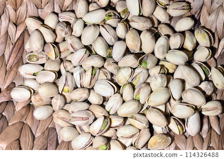 pistachio nuts in a solid layer close up for the background pistachio nuts in a solid layer close up for the background 114326488