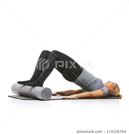 Core exercise, foam roller and studio woman with bridge workout, balance activity or wellness for gym pilates on floor. Fitness, mockup space and girl body development on yoga mat on white background 114326769