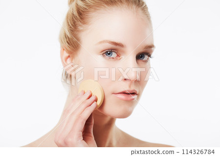 Cotton pad, skincare or portrait of a model in studio for cleaning, beauty or dermatology treatment. White background, face or confident woman with pad for facial, toner and cosmetics with foundation 114326784