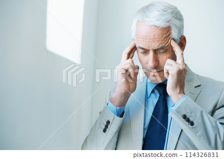 CEO, headache and business man with pain, tired or burnout at company office. Migraine, senior manager and massage temples for stress, sick or frustrated at mistake with anxiety for financial crisis 114326831