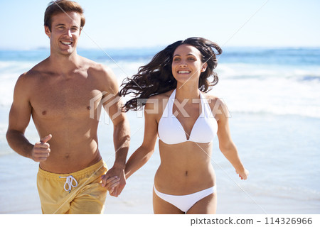 Holding hands, run and happy couple on beach for holiday adventure together on tropical island with waves. Love, man and woman on fun ocean vacation with waves, romance and smile on travel in Hawaii. Holding hands, run and happy couple on beach for holiday adventure together on tropical island with waves. Love, man and woman on fun ocean vacation with waves, romance and smile on travel in Hawaii. 114326966