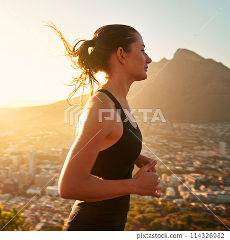 Fitness, running and woman with sunset in mountain for health, wellness and strong body development. Workout, exercise and girl runner in nature for marathon training, performance and city challenge. 114326982
