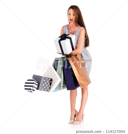 Shock, shopping bags and woman with gifts falling in studio with upset, wtf or omg face. Surprise, boxes and full body of female person with full hands for stack of presents by white background. 114327004