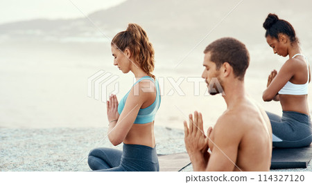 Fitness, meditation and yoga with friends on beach for mental health, peace or wellness in morning. Exercise, training and zen with sporty people on mat at coast by ocean for balance or mindset Fitness, meditation and yoga with friends on beach for mental health, peace or wellness in morning. Exercise, training and zen with sporty people on mat at coast by ocean for balance or mindset 114327120