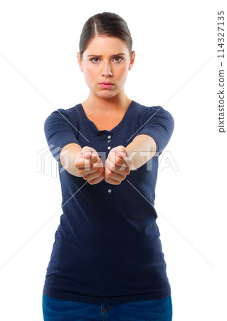 Woman, arms together and portrait for handcuff, criminal and guilty for arrested, crime and illegal. Young person with scared facial expression for surrender, corrupt and prisoner on white backdrop 114327135