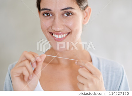 Woman, portrait and happy with dental floss in home for health, wellness or care for teeth in morning. Girl, person and smile with string for oral, mouth or cleaning for hygiene at apartment in Chile 114327150
