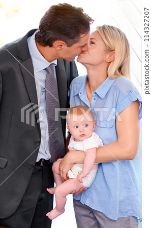 Love, family and parents kiss with baby, bonding or affection at home on valentines day. Child, toddler or mother with father in romance for connection, care or healthy relationship together in house Love, family and parents kiss with baby, bonding or affection at home on valentines day. Child, toddler or mother with father in romance for connection, care or healthy relationship together in house 114327207