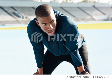 Fitness, running and tired with sports black man in stadium venue for competition or performance. Exercise, fatigue and training with athlete or runner in recovery from outdoor marathon or race Fitness, running and tired with sports black man in stadium venue for competition or performance. Exercise, fatigue and training with athlete or runner in recovery from outdoor marathon or race 114327208