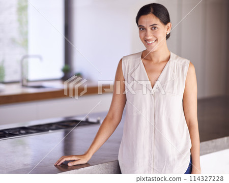 Woman, relax and portrait in kitchen of modern house with granite counter, gas stove and happy homeowner. Property, real estate and person with pride for home, minimal interior design and space 114327228