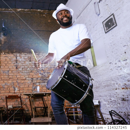 Music, carnival and drummer or performance, show and musician on stage. Concert, entertainment or fun celebration for musical artist, smile and drum for male Brazilian talent from low angle 114327245
