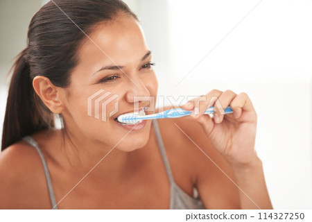 Health, bathroom and woman with toothbrush for cleaning, oral hygiene and dental care in home. Toothpaste, healthcare and person brushing teeth for whitening, wellness and grooming for gum disease 114327250