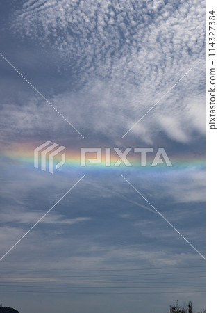 A circumhorizontal arc in the blue sky A straight rainbow A circumhorizontal arc in the blue sky A straight rainbow 114327384