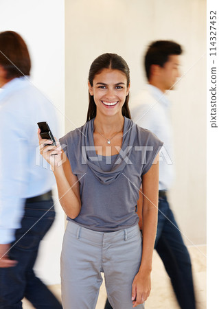 Businesswoman, portrait and phone with hand in busy office with communication for company with research. Female person, mobile and work with screen for brand, taking and call in profession with tech 114327452