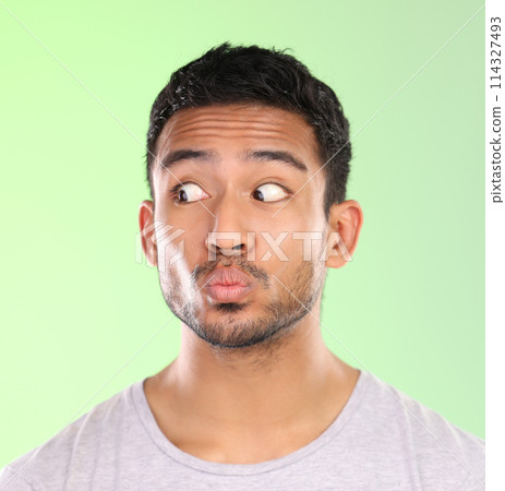 Face, man and pout in studio with eyes, expression and comic isolated on backdrop. Emoji, funny or comedy and confused or thinking for male model person, goofy or contemplation with emotion for humor 114327493