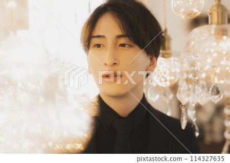 Man in black suit 114327635