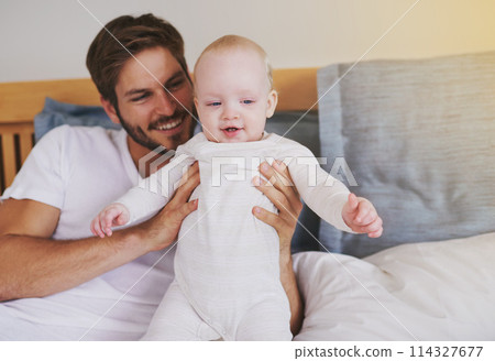 Family, love and father with baby in bedroom for bonding, relationship and care for parenting. Happy, home and dad playing with newborn infant for child development, support and affection in house 114327677