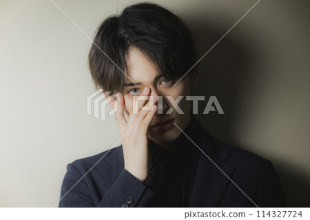 Man wearing colored contact lenses 114327724